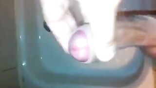 The kid caresses his dick in the shower and masturbates to the end