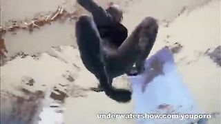 A hot girl is floating naked in the pool