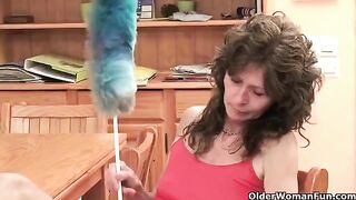 A mature woman plays with her pussy using her fingers and a sex toy