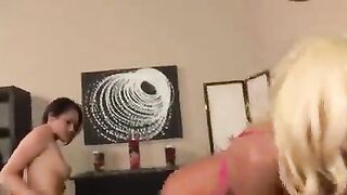 Two lesbian girls in skirts are fucking each other with a vibrator