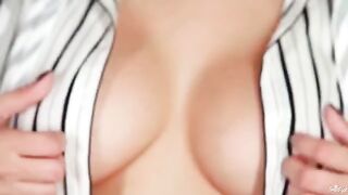 Beautiful woman with big natural breasts playing with them on cam