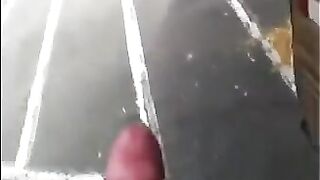 A man masturbates his cock right on the street and runs away