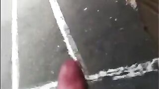 A man masturbates his cock right on the street and runs away