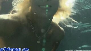 A blowjob scene takes place in the water to cool down a bit