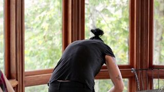 Vietnamese beauty fucked by her boyfriend with a strap-on in the kitchen