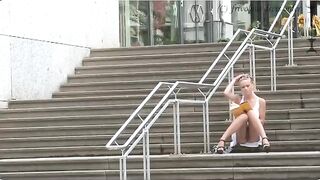A girl has no panties while walking on the street