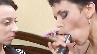 A Russian girl practices blowjob with her mother using a strapon