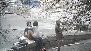 The guy shoots sex with a girl on the public street