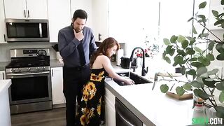 A man checked the strength of the kitchen tie of a sexy redhead