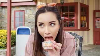 A girl is flashing her body in the theme park, and a guy wants her number