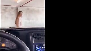 Redhead babe gets her pussy railed in the public garage for everyone to see