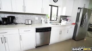 A mature woman is completely naked while she cleans the house
