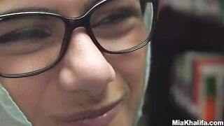 Busty Arab pornstar Mia Khalifa masturbating in the library, a sight to behold!