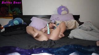 A hot young beauty plays with her feet before a delighted audience
