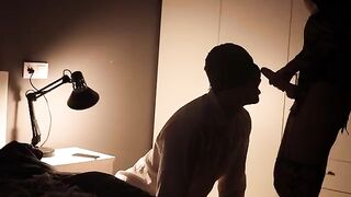 A hot Femdom blowjob with a guy using a fishnet and a strapon