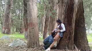 A pretty woman has sex with a man in the forest