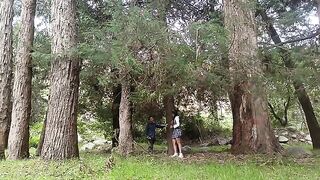 A pretty woman has sex with a man in the forest