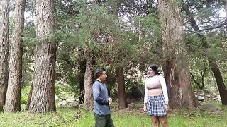 A pretty woman has sex with a man in the forest