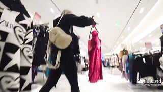 Blonde babe gets fucked in the fitting room, almost caught